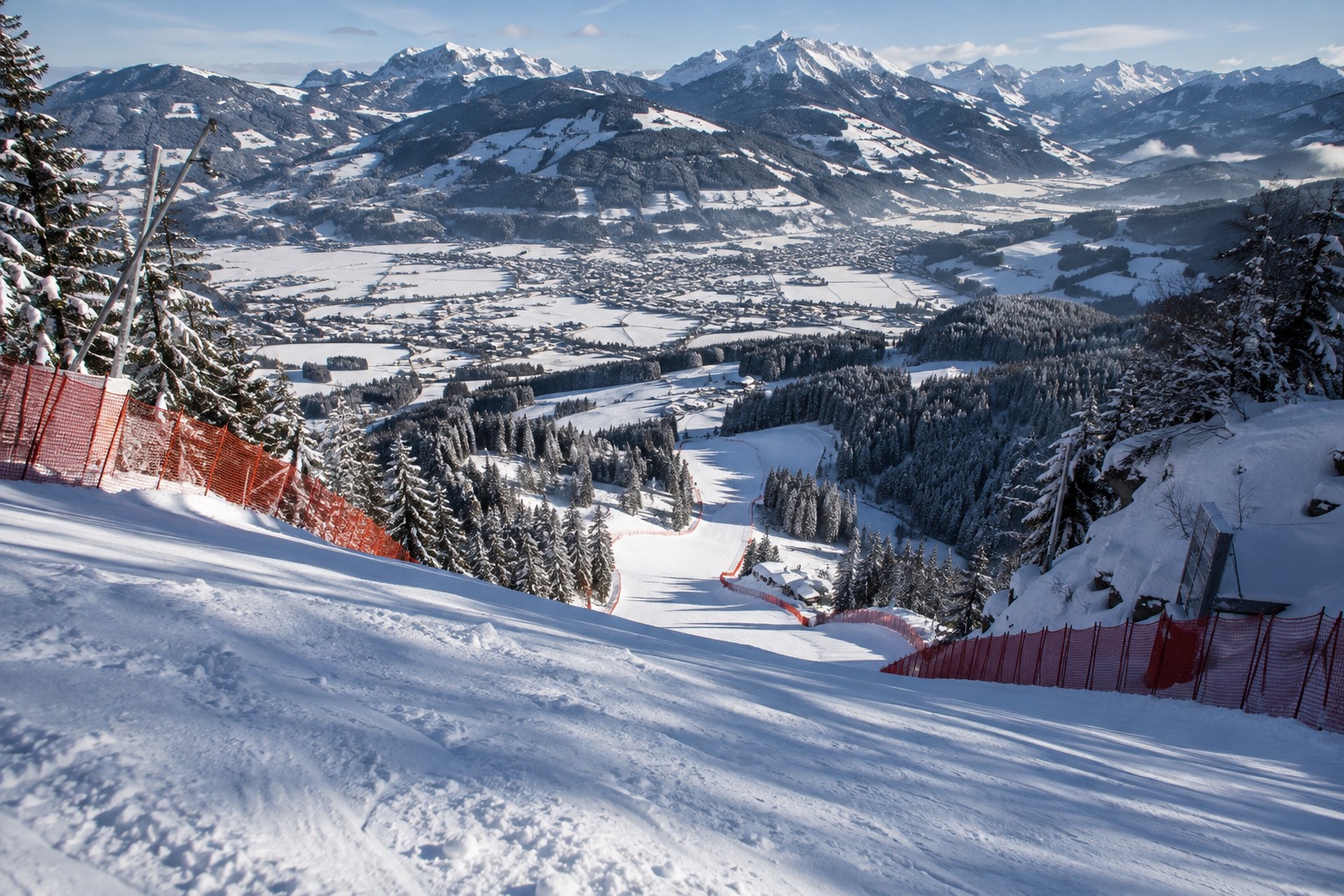 The steep Streif downhill piste on the Hahnenkamm above Kitzbühel, empty of racers, showing the real gradient